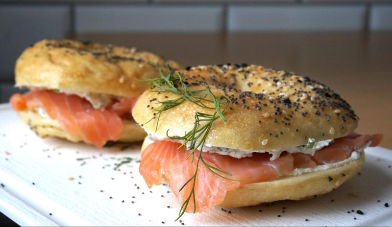 Norwegian Breakfast Sandwich with Smoked Salmon on a Onion Bagel